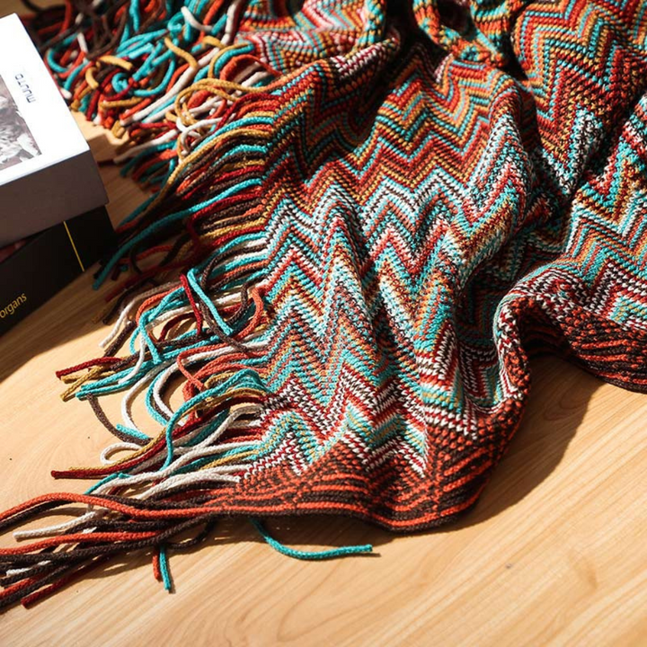 Plaid tricoté zigzag coloré à glands