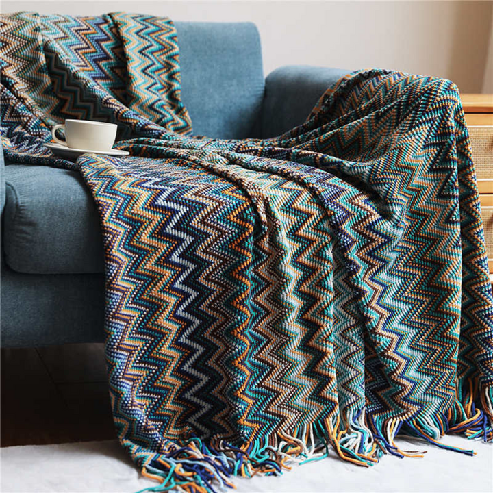 Plaid tricoté zigzag coloré à glands