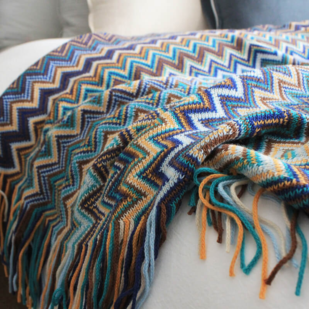 Plaid tricoté zigzag coloré à glands