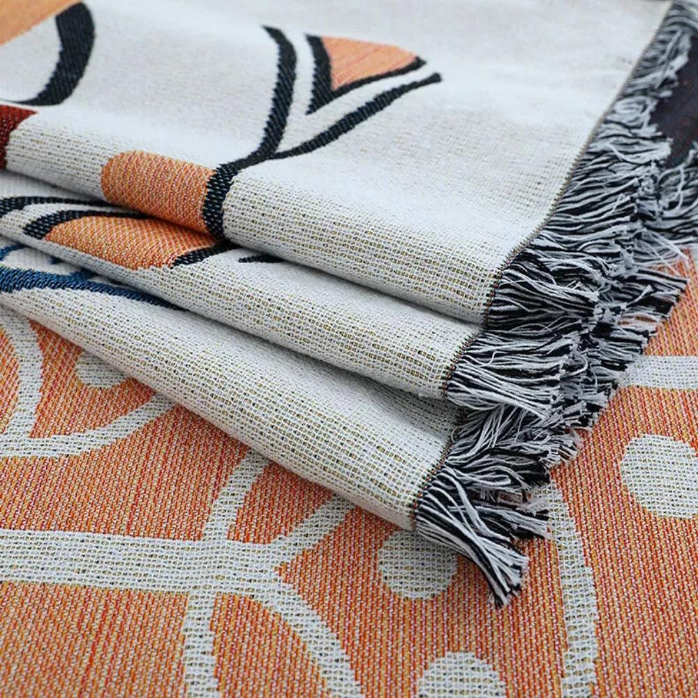 Jeté de canapé coton-lin jacquard à glands