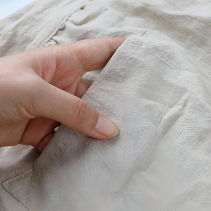 Tablier en mélange de coton à volants et poche