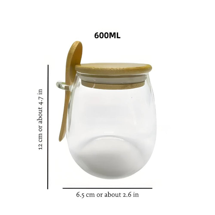 Vorratsglas mit Holzdeckel und Löffel