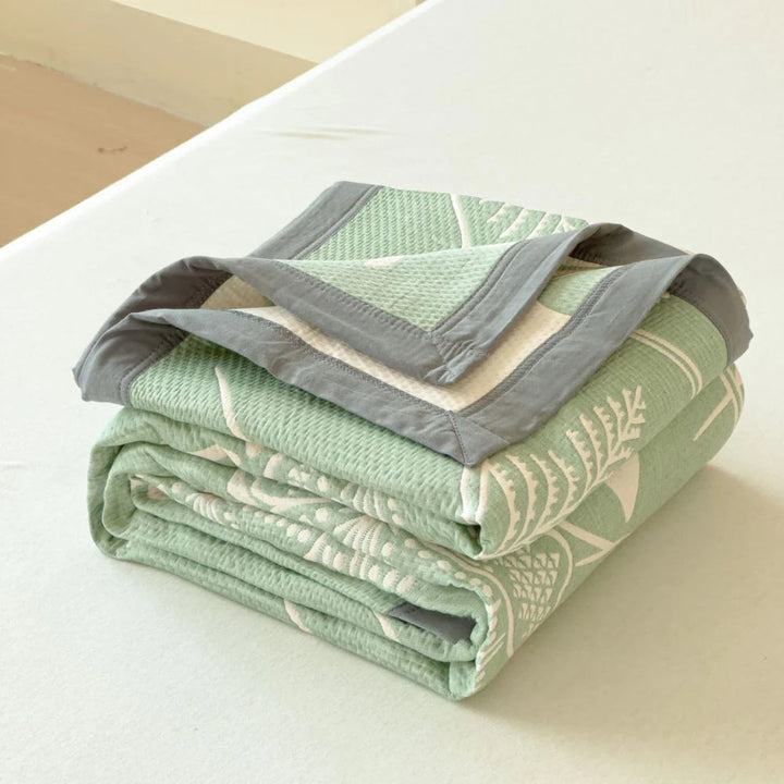 Wendbare Tagesdecke aus Baumwollmusselin mit Blumenmuster