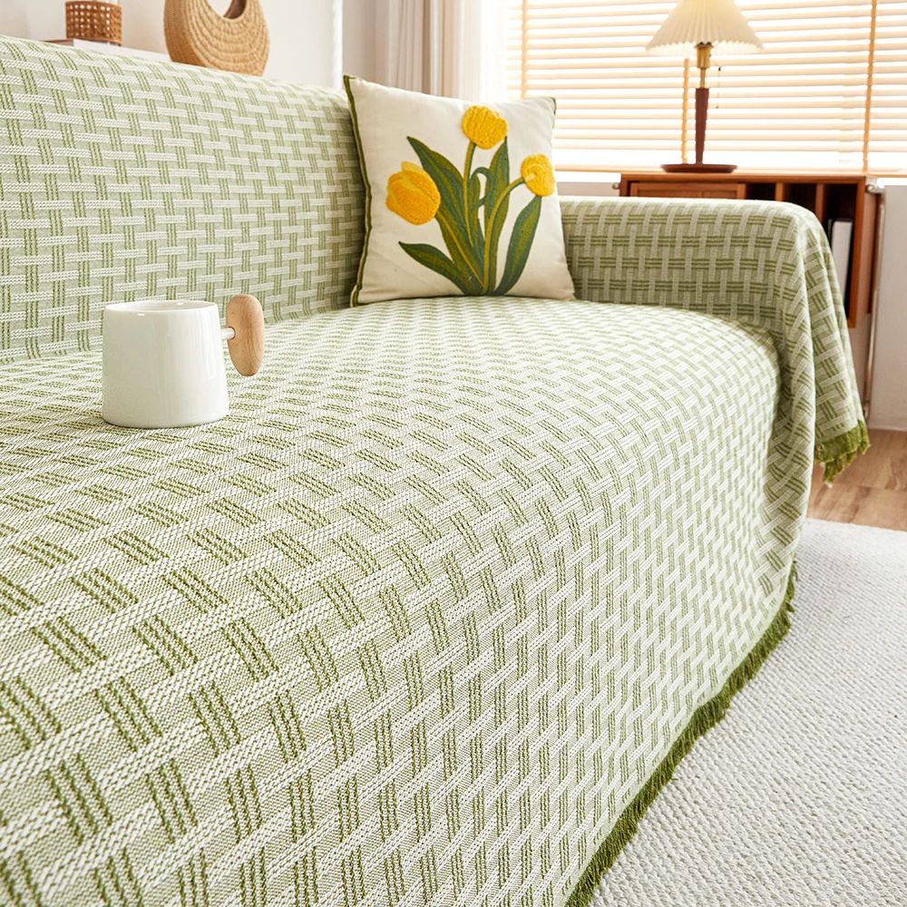 Sofaüberwurf gesteppt geometrisch mit Quasten