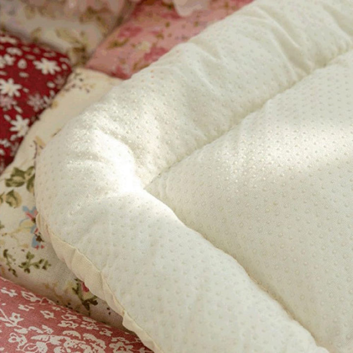 Sofaauflage gesteppt Blütenmuster