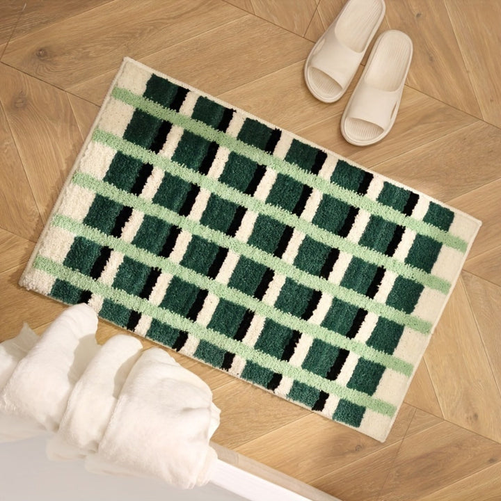Tapis de bain géométrique vert mousse
