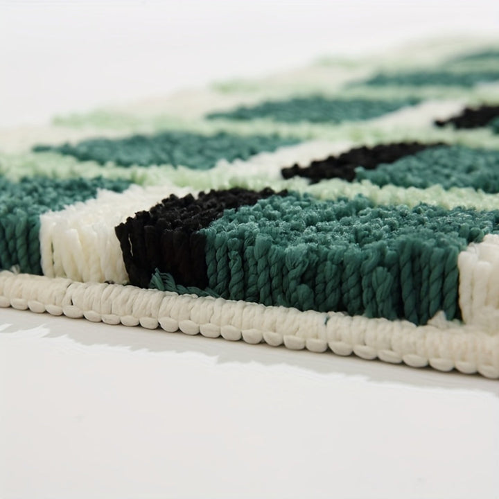 Tapis de bain géométrique vert mousse