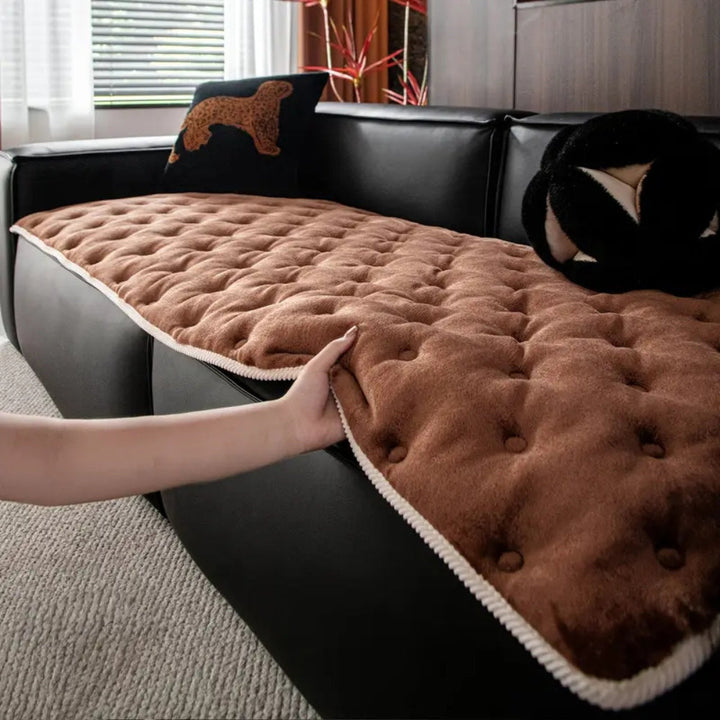 Sofaüberwurf mit Knopfsteppung