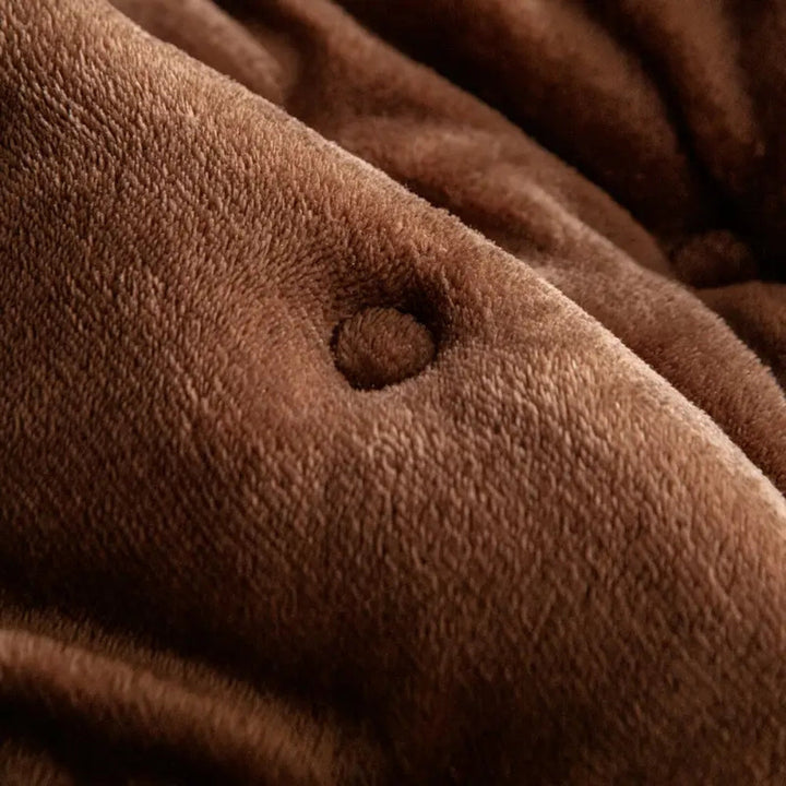 Sofaüberwurf mit Knopfsteppung