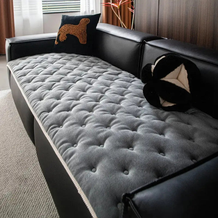 Sofaüberwurf mit Knopfsteppung