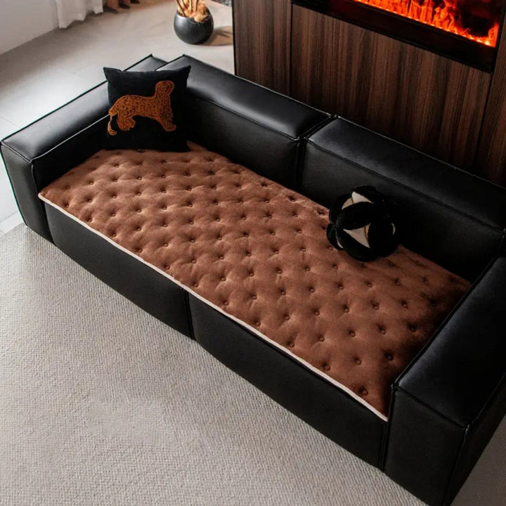 Sofaüberwurf mit Knopfsteppung