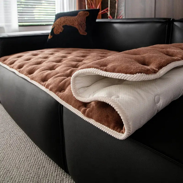 Sofaüberwurf mit Knopfsteppung