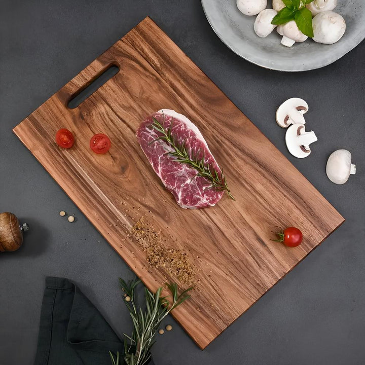 Planche à découper en bois massif à poignée
